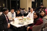 College teachers and students at a communal dinner